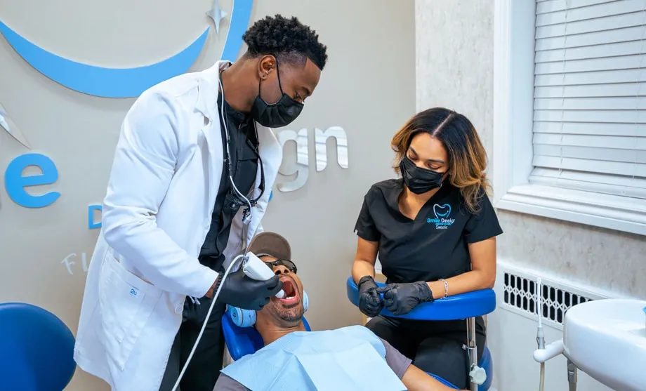 Photo of Doctor Aguebor educating a patient