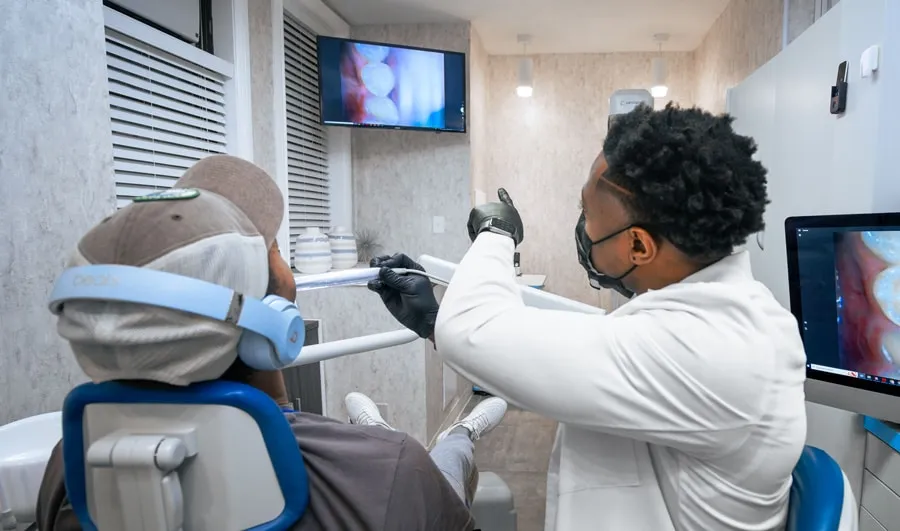 Photo of Doctor Aguebor educating a patient