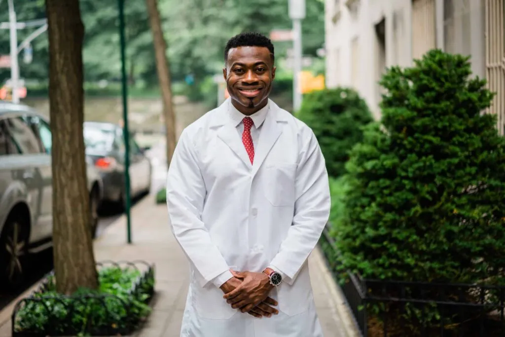 Photo of Doctor Aguebor educating a patient