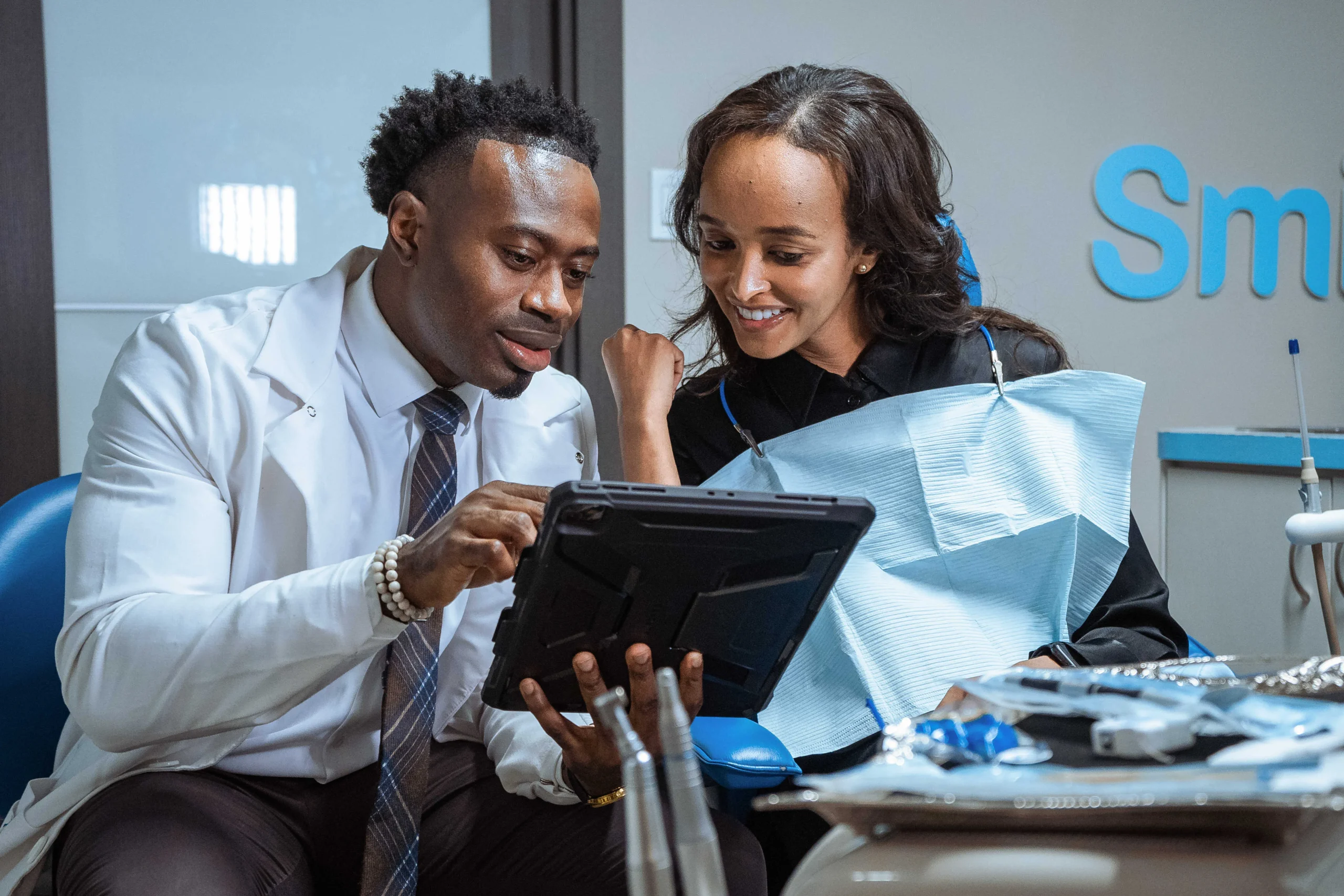 Photo of Doctor Aguebor educating a patient