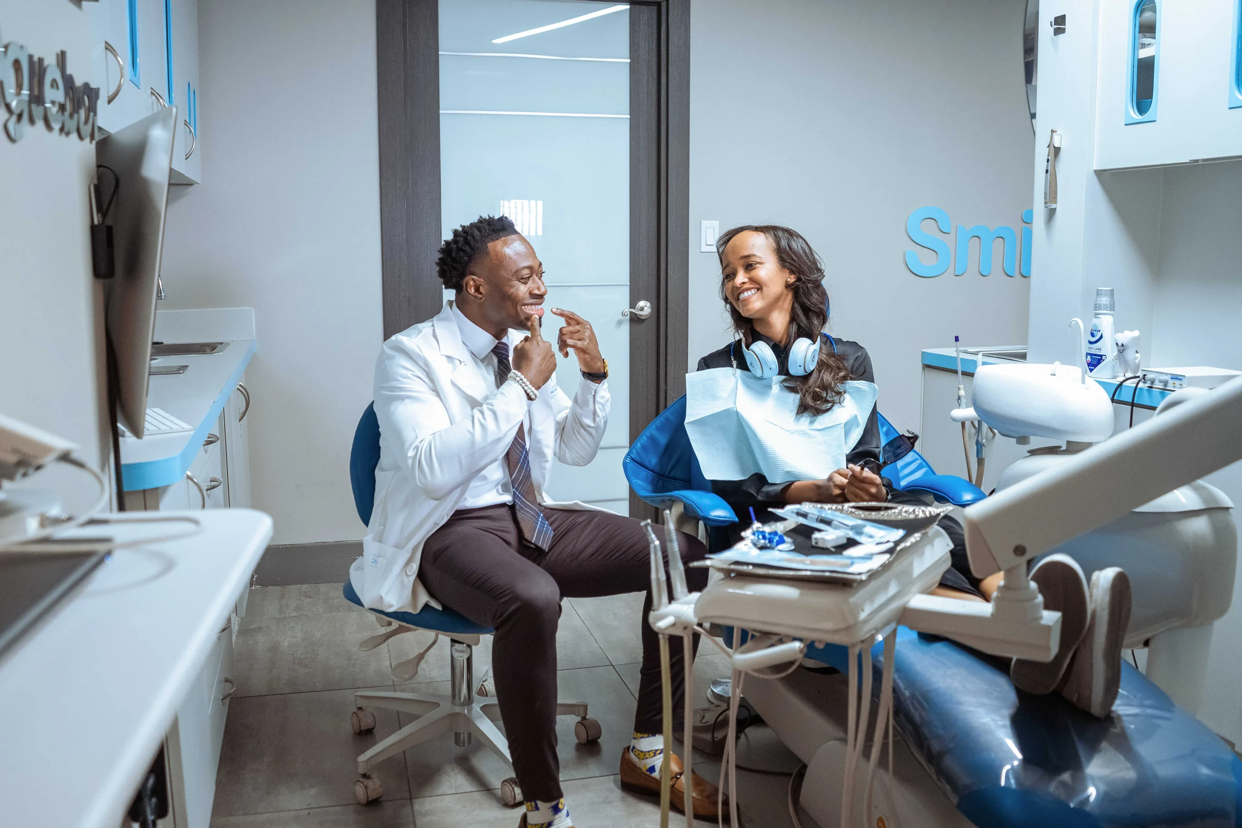 Photo of Doctor Aguebor with a patient